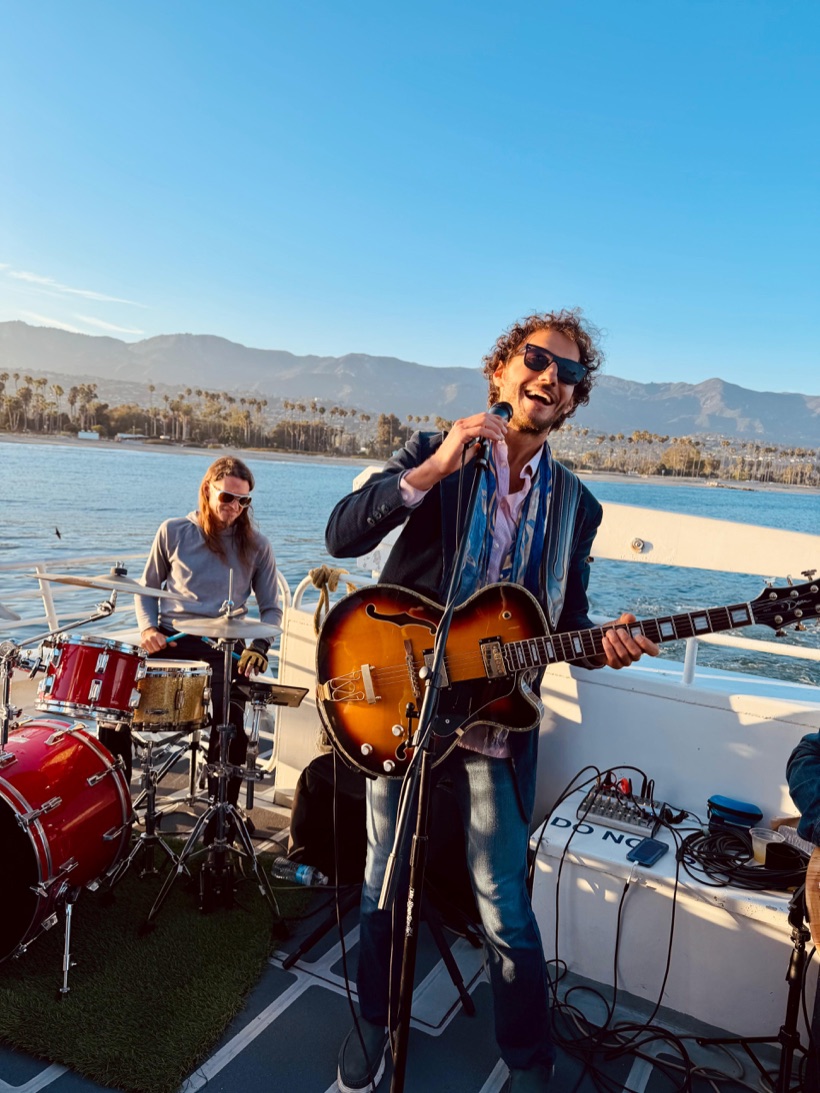 David Segall performing live with his band aboard a yacht off the Santa Barbara coast